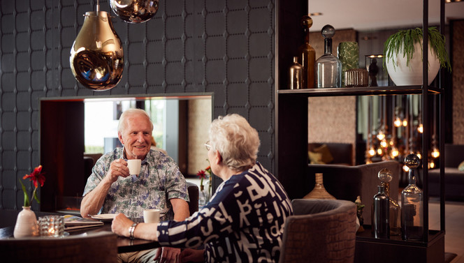 Seniors couple in brasserie